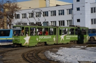 A typical Lviv tram doing a roundabout near the main railway station on a winter day