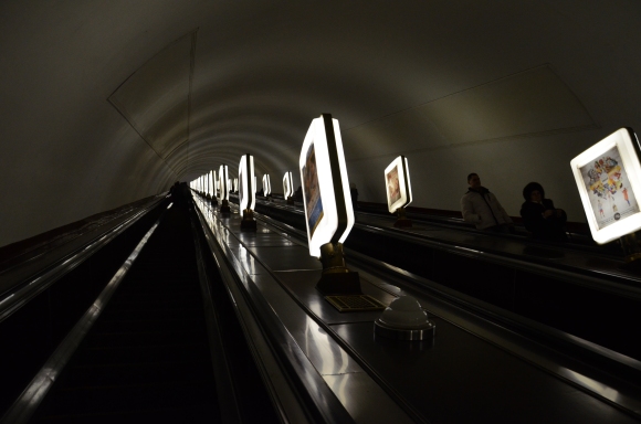Riding the long escalator up Arsenalna station, which is 105.5 metres below the ground